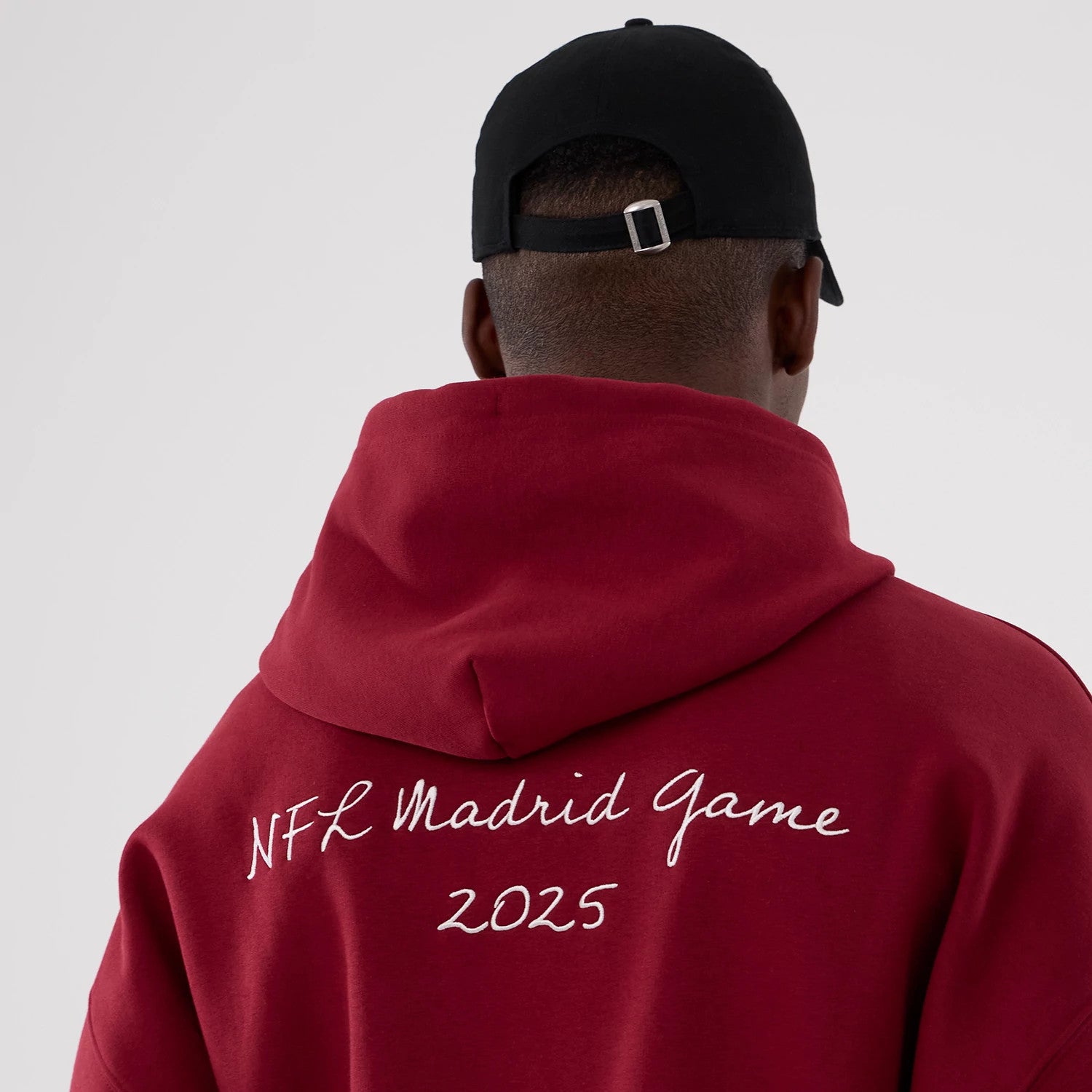 The Male model is wearing Washington Commanders NFL International Series Games 2025 Dark Red Premium Pullover Hoodie 6