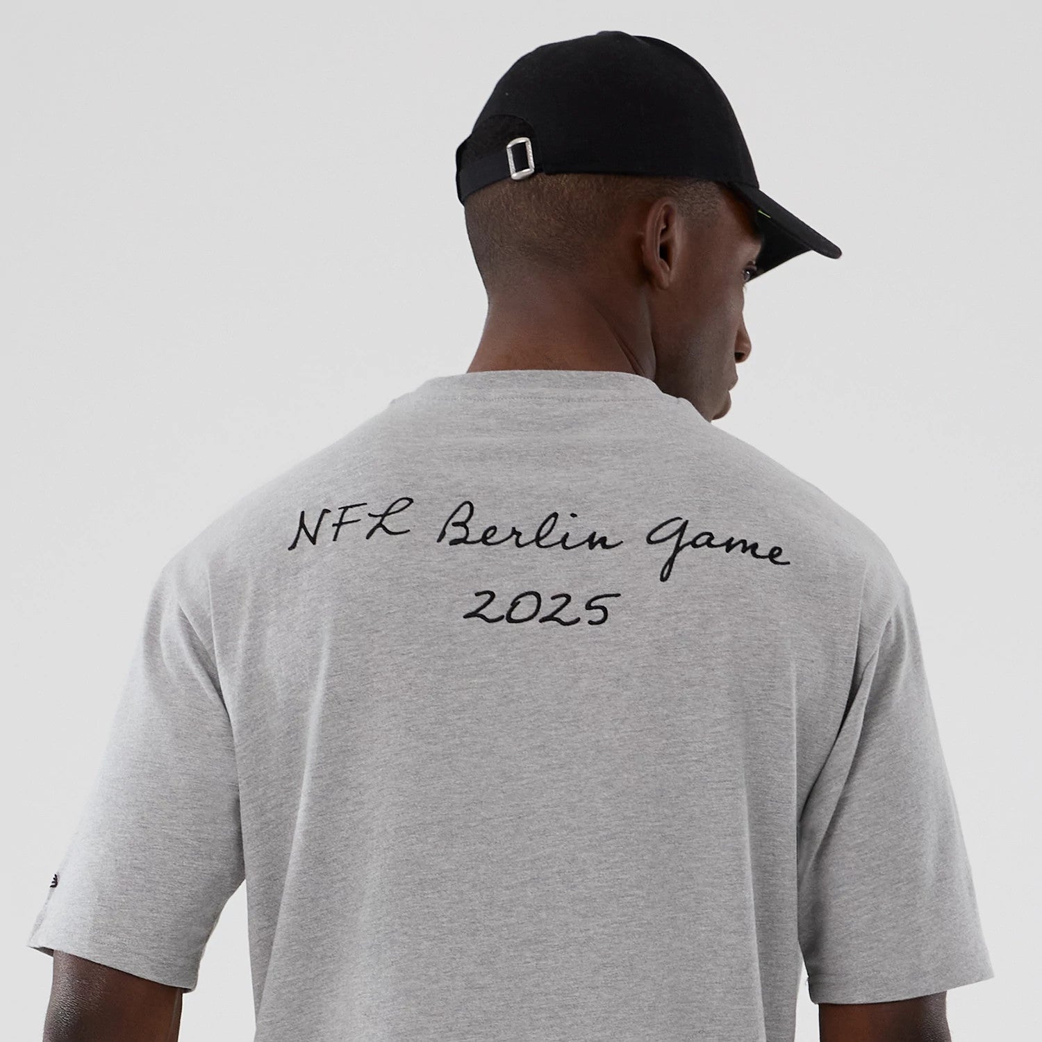 The Male model is wearing Atlanta Falcons NFL International Series Games 2025 Grey Premium T-Shirt 6