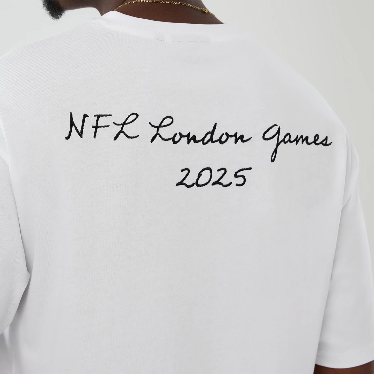 The Male model is wearing LA Rams NFL International Series Games 2025 White Premium T-Shirt 6