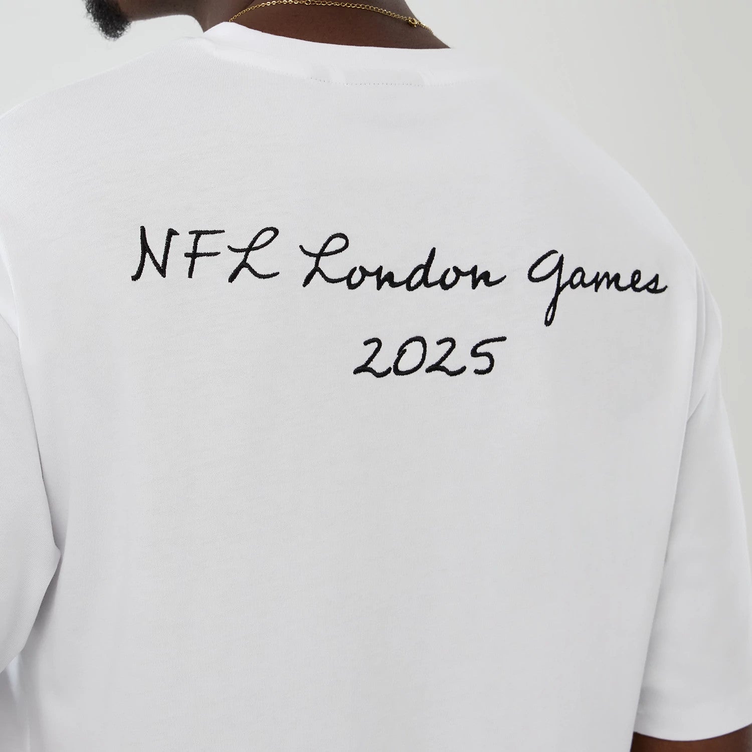The Male model is wearing LA Rams NFL International Series Games 2025 White Premium T-Shirt 6