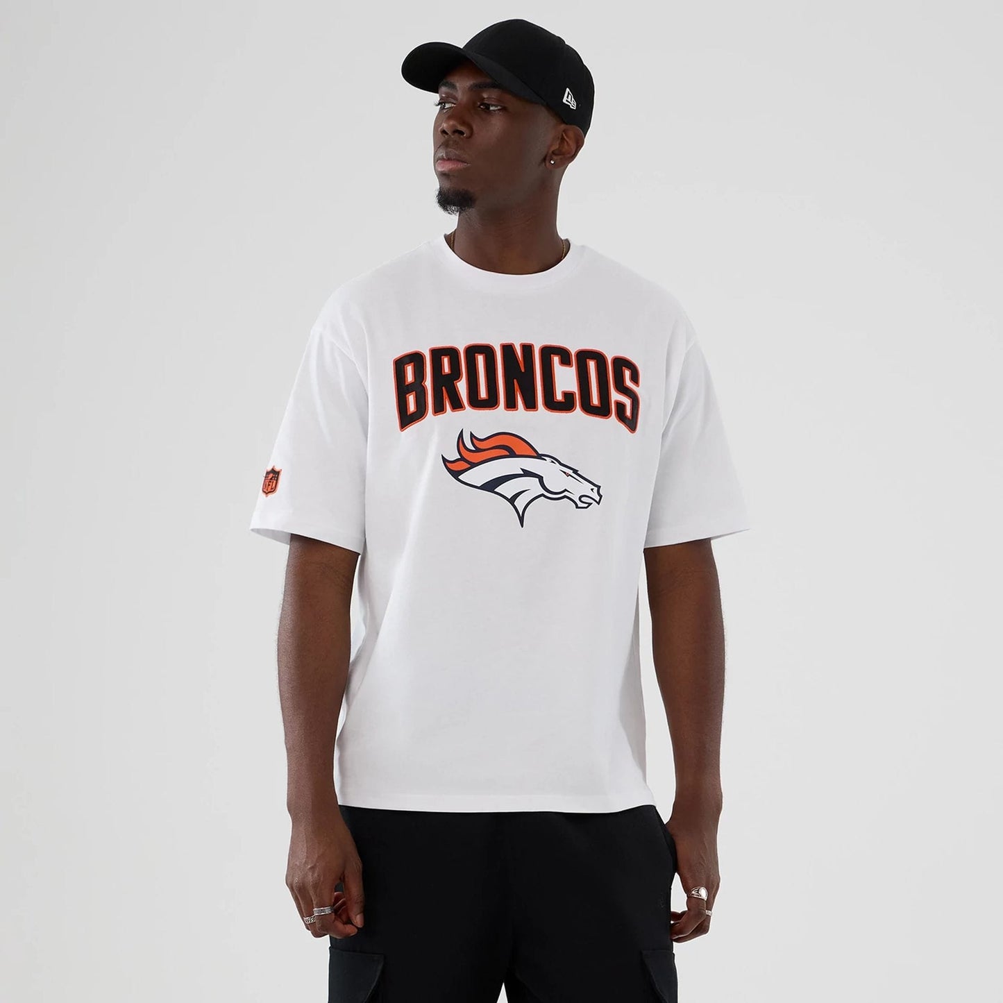 The Male model is wearing Denver Broncos NFL International Series Games 2025 White Premium T-Shirt 1