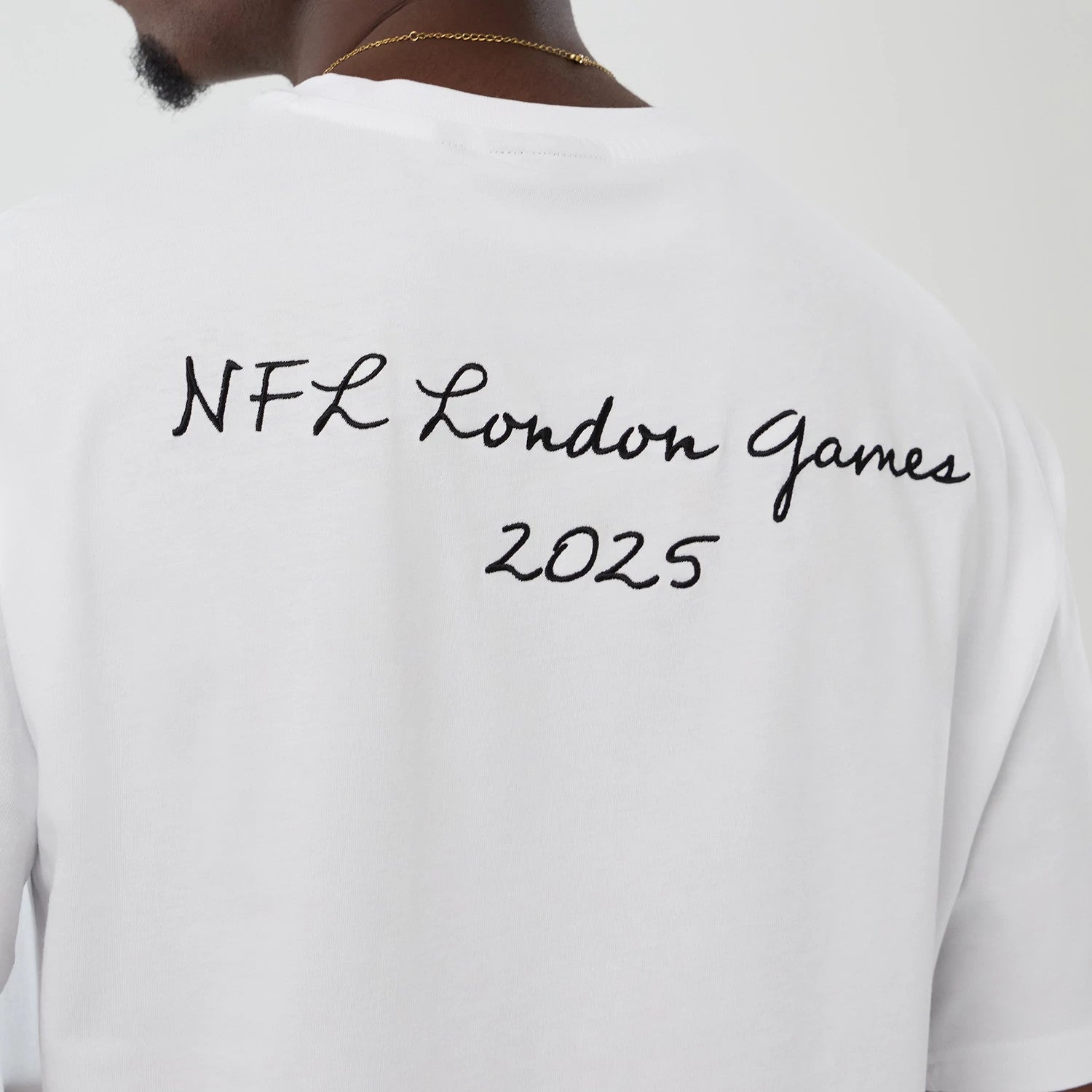 The Male model is wearing Denver Broncos NFL International Series Games 2025 White Premium T-Shirt 4