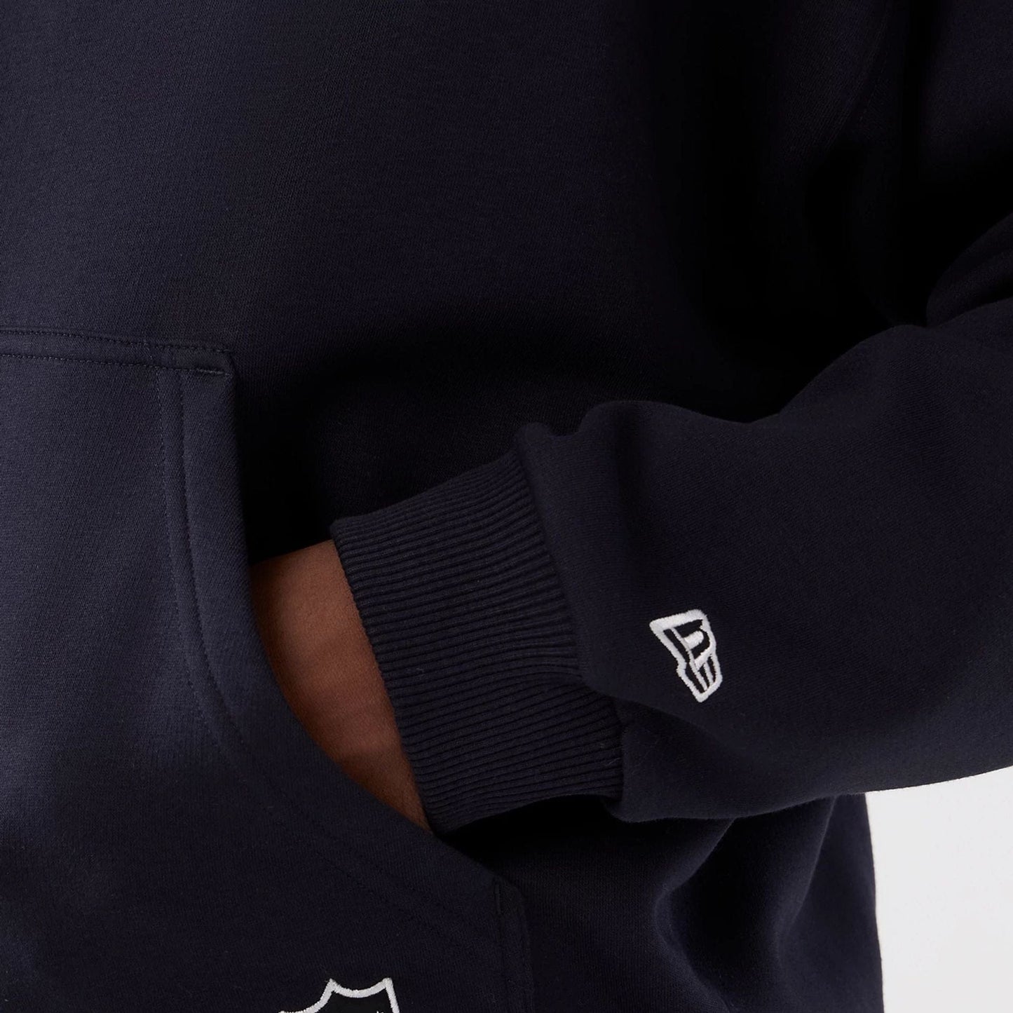 The Male model is wearing Denver Broncos NFL International Series Games 2025 Navy Premium Pullover Hoodie  6