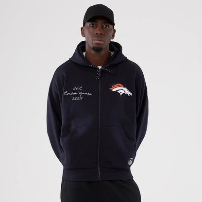 The Male model is wearing Denver Broncos NFL International Series Games 2025 Navy Premium Pullover Hoodie 1