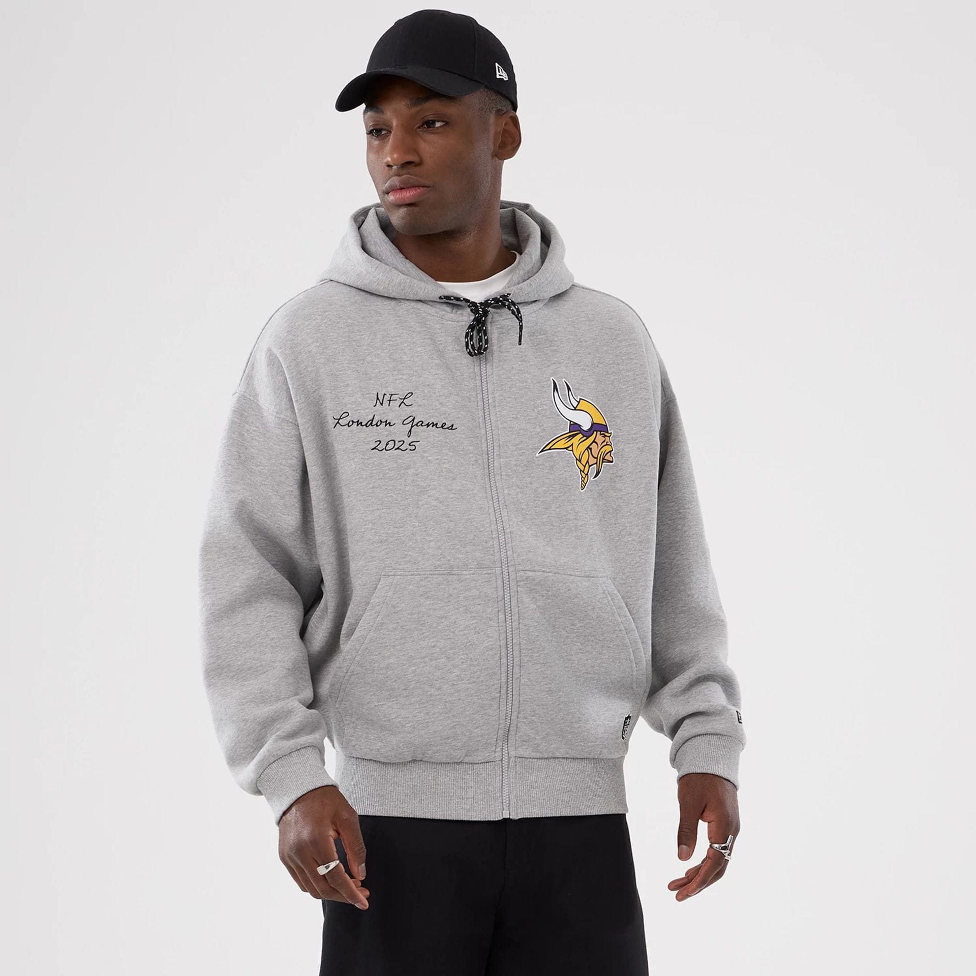 The Male model is wearing Minnesota Vikings NFL International Series Games 2025 Grey Premium Pullover Hoodie 1