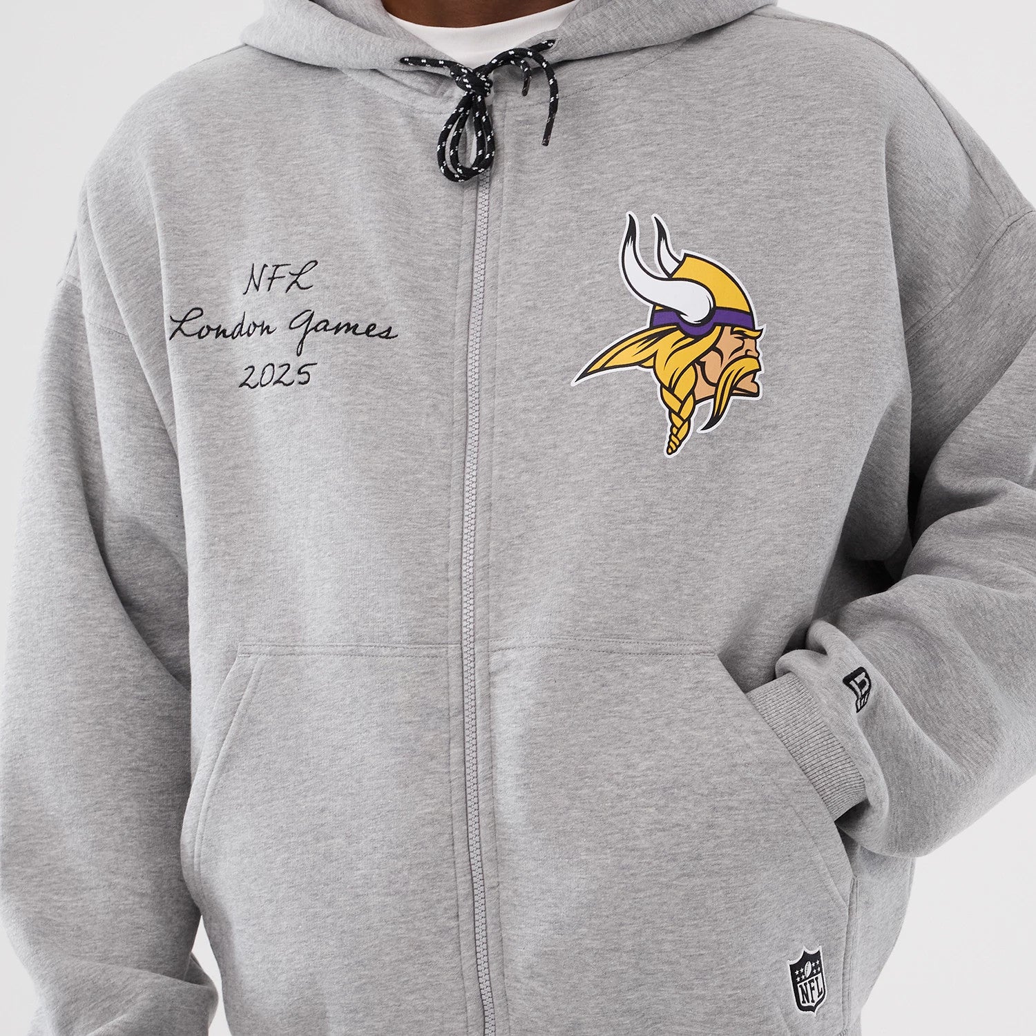 The Male model is wearing Minnesota Vikings NFL International Series Games 2025 Grey Premium Pullover Hoodie 3