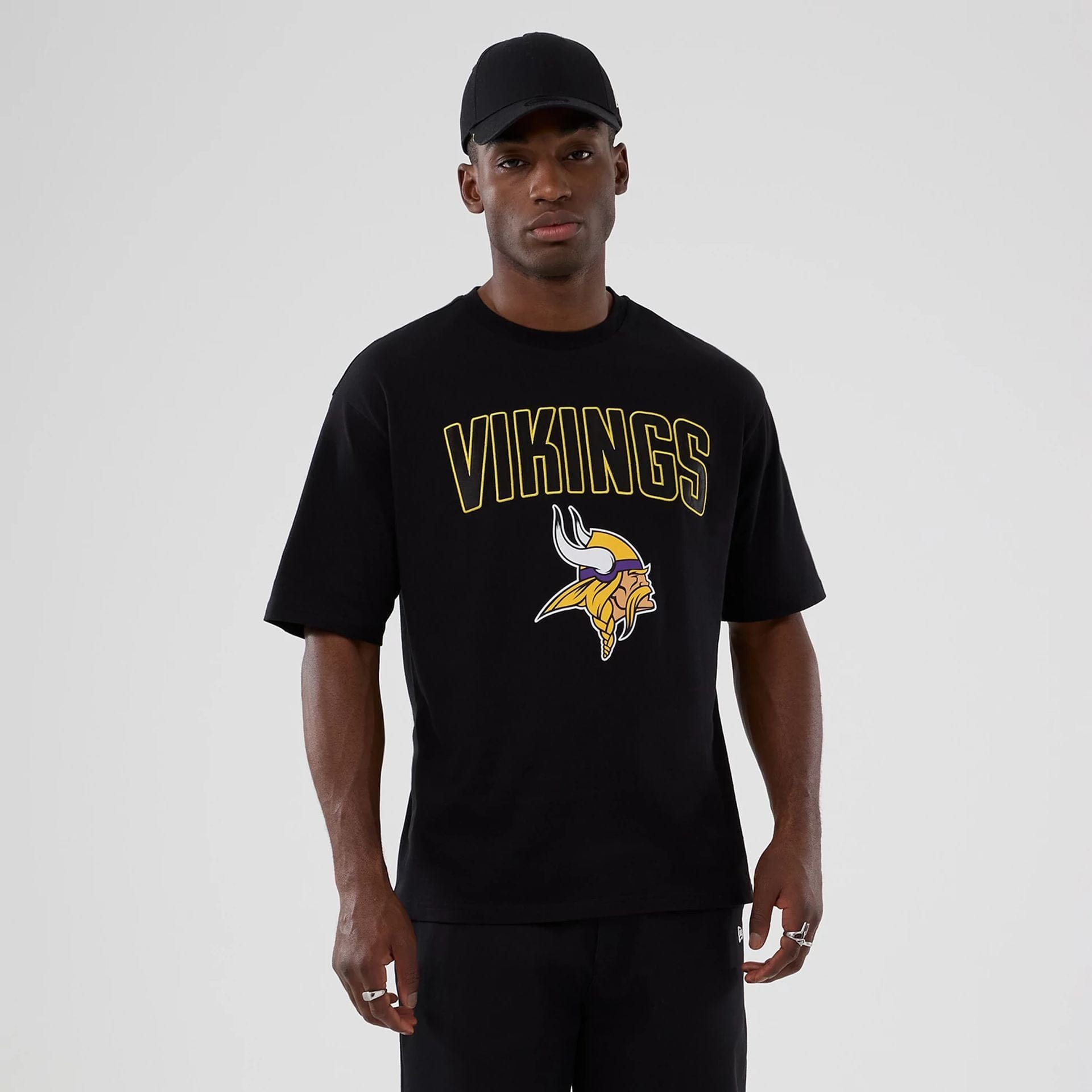 The Male model is wearing Minnesota Vikings NFL International Series Games 2025 Black Premium T-Shirt  1