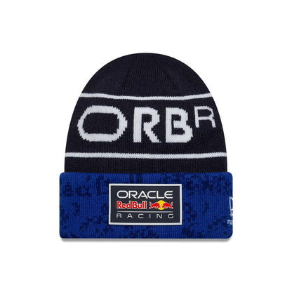 New Era Red Bull Racing Youth Team Dark Blue Cuff Knit Beanie Hat, front view showing a white ORBR design across the crown and a rectangular Oracle Red Bull Racing logo patch on the blue cuff with patterned texture.