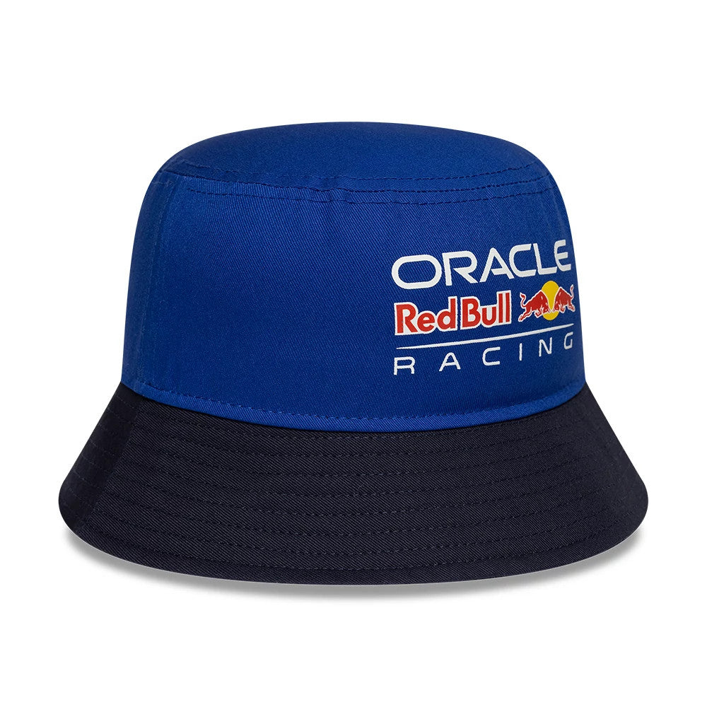 New Era Red Bull Racing Youth Essential Dark Blue Bucket Hat, three-quarter view showing the Oracle Red Bull Racing logo in white and red embroidery on the structured dark blue crown, with a contrasting black visor.
