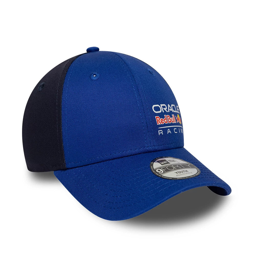 Red Bull Racing Youth Essential Dark Blue New Era 9FORTY Adjustable Cap, three-quarter view with a raised Oracle Red Bull Racing logo in red, blue, and white embroidery on the front panel and a grey 9FORTY size sticker on the blue curved visor.