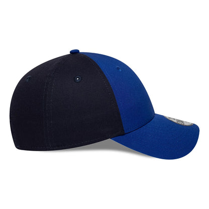 Red Bull Racing Youth Essential Dark Blue New Era 9FORTY Adjustable Cap, side view showing the contrasting dark blue and bright blue panels with eyelets and a curved visor featuring a 9FORTY size sticker.