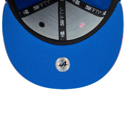 Alpine Racing Summer League Blue New Era 59FIFTY Fitted Cap, inside view showing the grey undervisor with a circular holographic sticker, black taping with 59FIFTY branding, and a pink eyelet detail against the blue fabric.