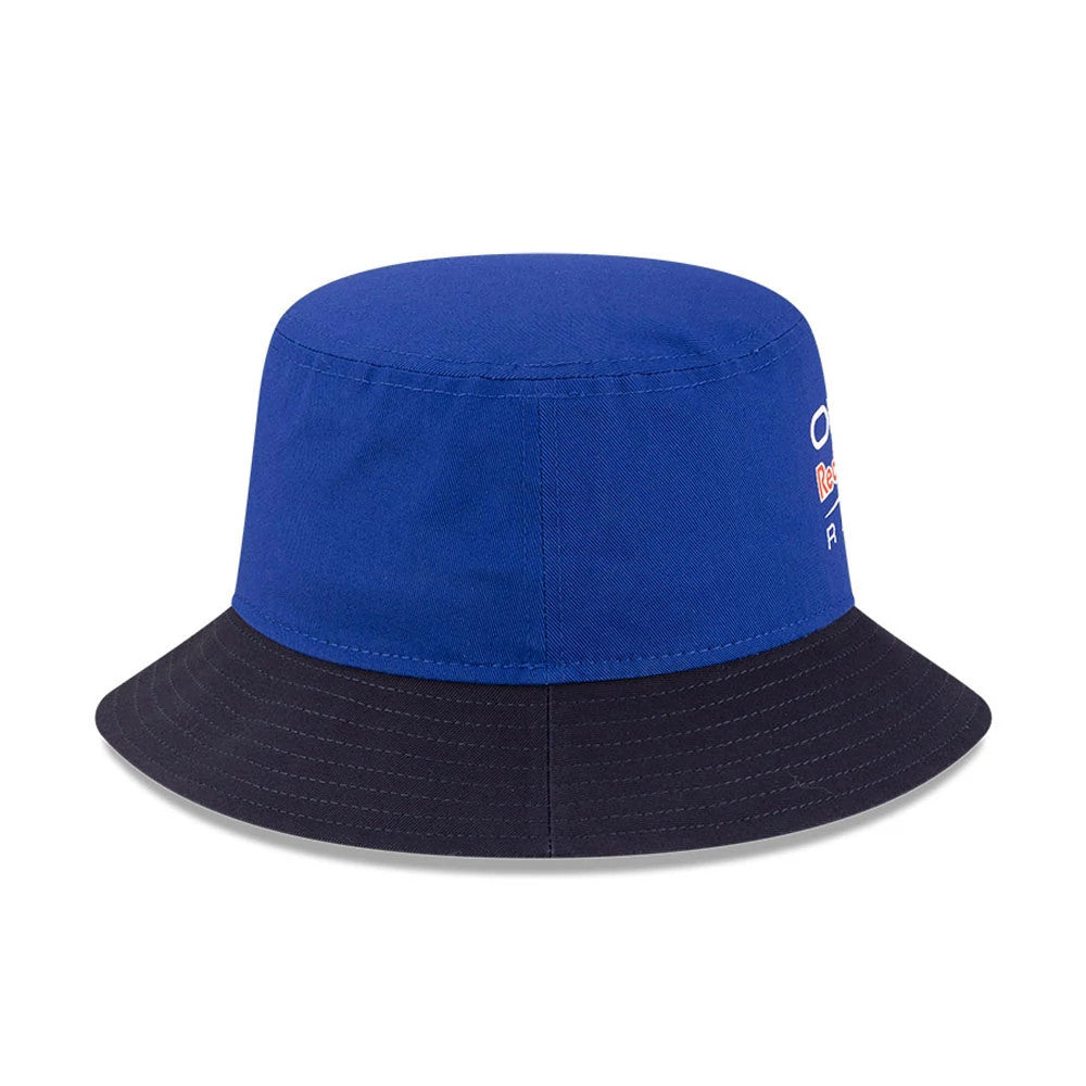 New Era Red Bull Racing Essential Dark Blue Bucket Hat, side view showing the embroidered Red Bull Racing logo on the dark blue crown, with a contrasting black visor.