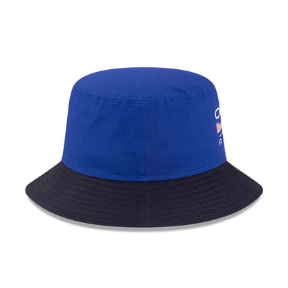 New Era Red Bull Racing Essential Dark Blue Bucket Hat, side view showing the embroidered Red Bull Racing logo on the dark blue crown, with a contrasting black visor.