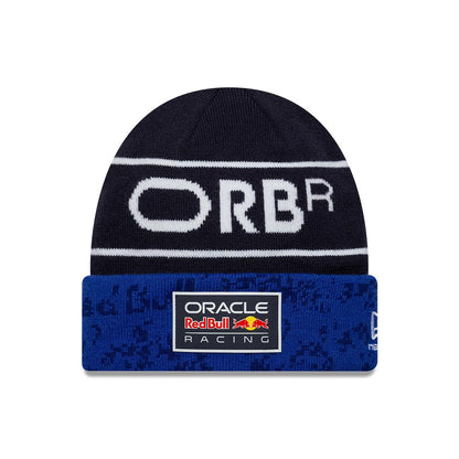 New Era Red Bull Racing Team Dark Blue Cuff Knit Beanie Hat, front view showing white ORBR lettering across the top, with a blue cuff featuring the Oracle Red Bull Racing logo patch and a New Era flag logo on the side.