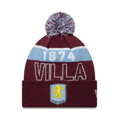Pictured is this Aston Villa FC Bobble Knit Beanie hat in dark red. 1