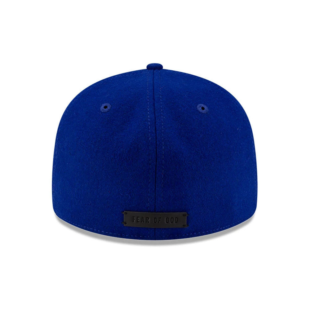 LA Dodgers FOG X MLB Dark Blue Retro Crown New Era 59FIFTY Fitted Cap, rear view showing a black Fear of God logo patch on the dark blue crown with matching eyelets and top button.