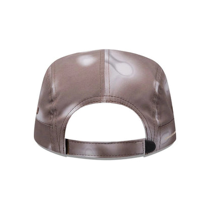 Pictured is this Hermanos Koumori x New Era Camper cap in dark brown. 4