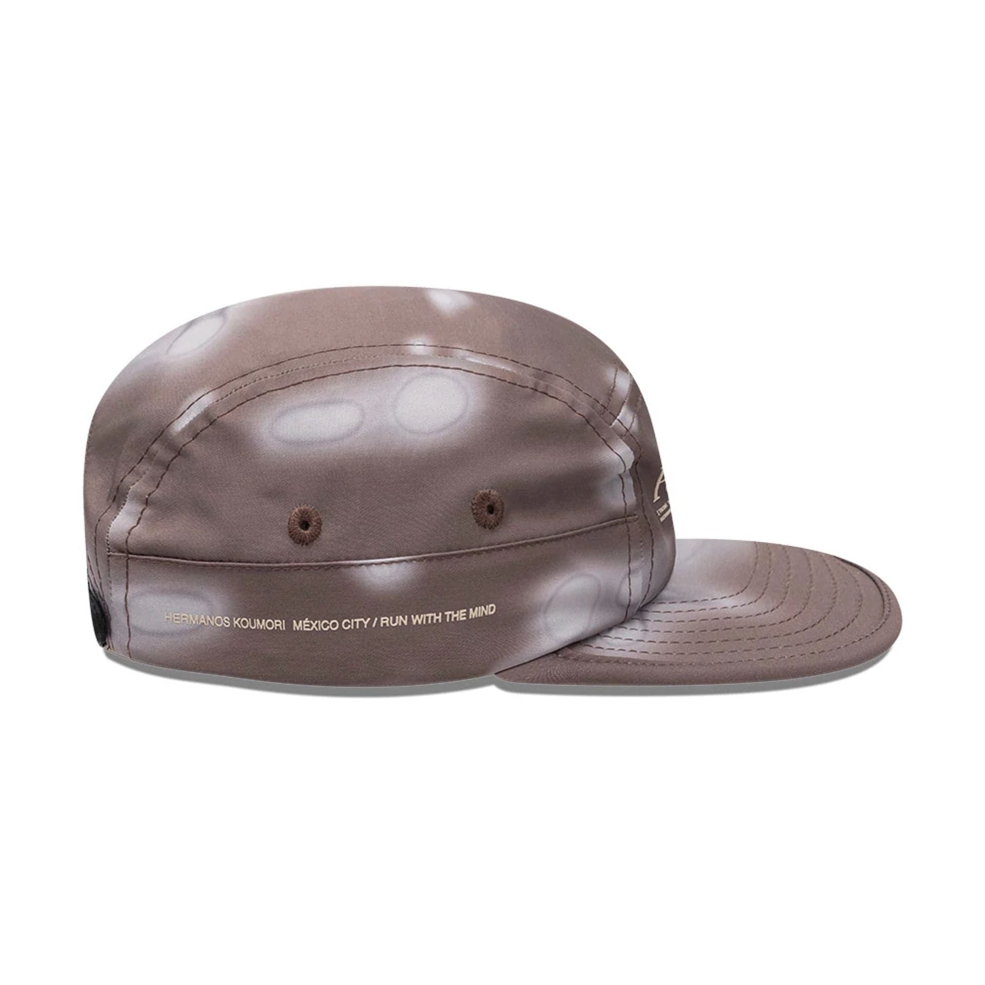 Pictured is this Hermanos Koumori x New Era Camper cap in dark brown. 5