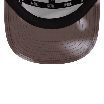 Pictured is this Hermanos Koumori x New Era Camper cap in dark brown. 6