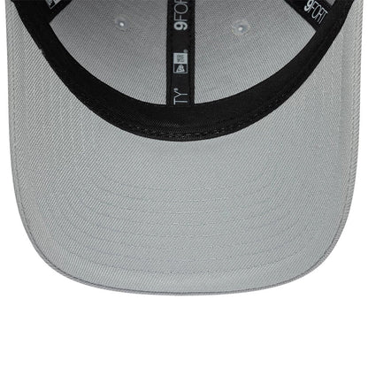Colucci X New Era Grey 9FORTY Adjustable Cap, inside view showing the black taping with white 9FORTY branding and a black sweatband, set against a light grey undervisor with eyelets.