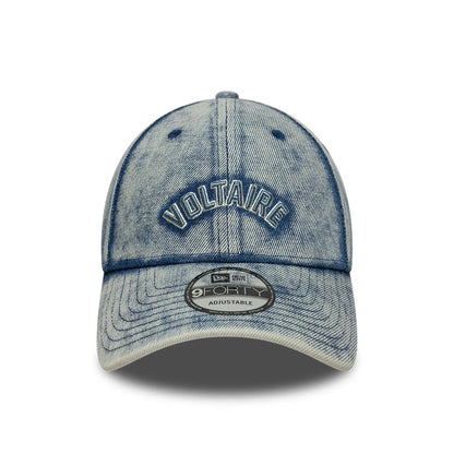New Era X Zadig & Voltaire Pastel Blue 9FORTY Adjustable Cap, front view showing a VOLTAIRE raised embroidery on the faded blue denim front panel, with a grey 9FORTY size sticker on the curved visor.