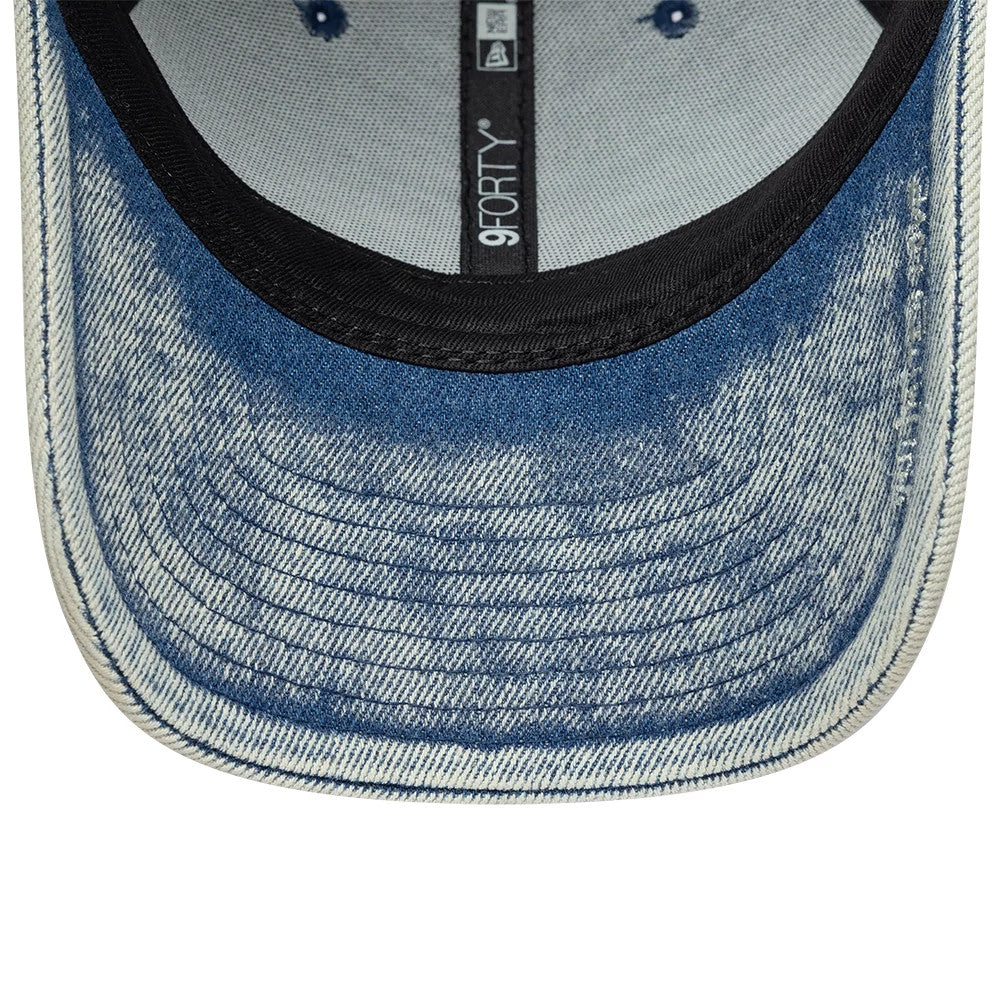 New Era X Zadig & Voltaire Pastel Blue 9FORTY Adjustable Cap, inside view showing the black sweatband, grey taping, and denim-style pattern on the blue undervisor, with blue stitched eyelets on the fabric.