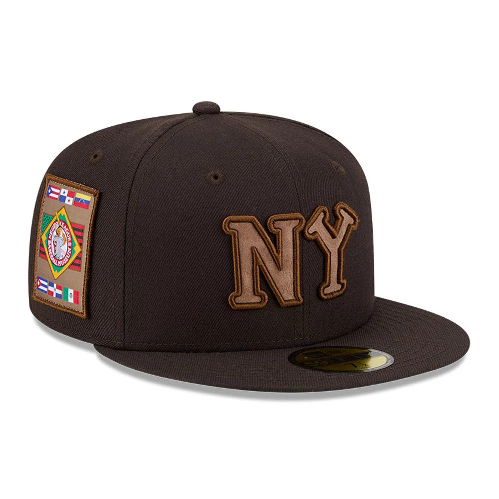 New York Black Yankees MLB Negro League Dark Brown New Era 59FIFTY Fitted Cap, three-quarter view showing the brown raised embroidery NY logo on the front panel, flat dark brown visor, and flag patch on the side, with a gold 59FIFTY size sticker.