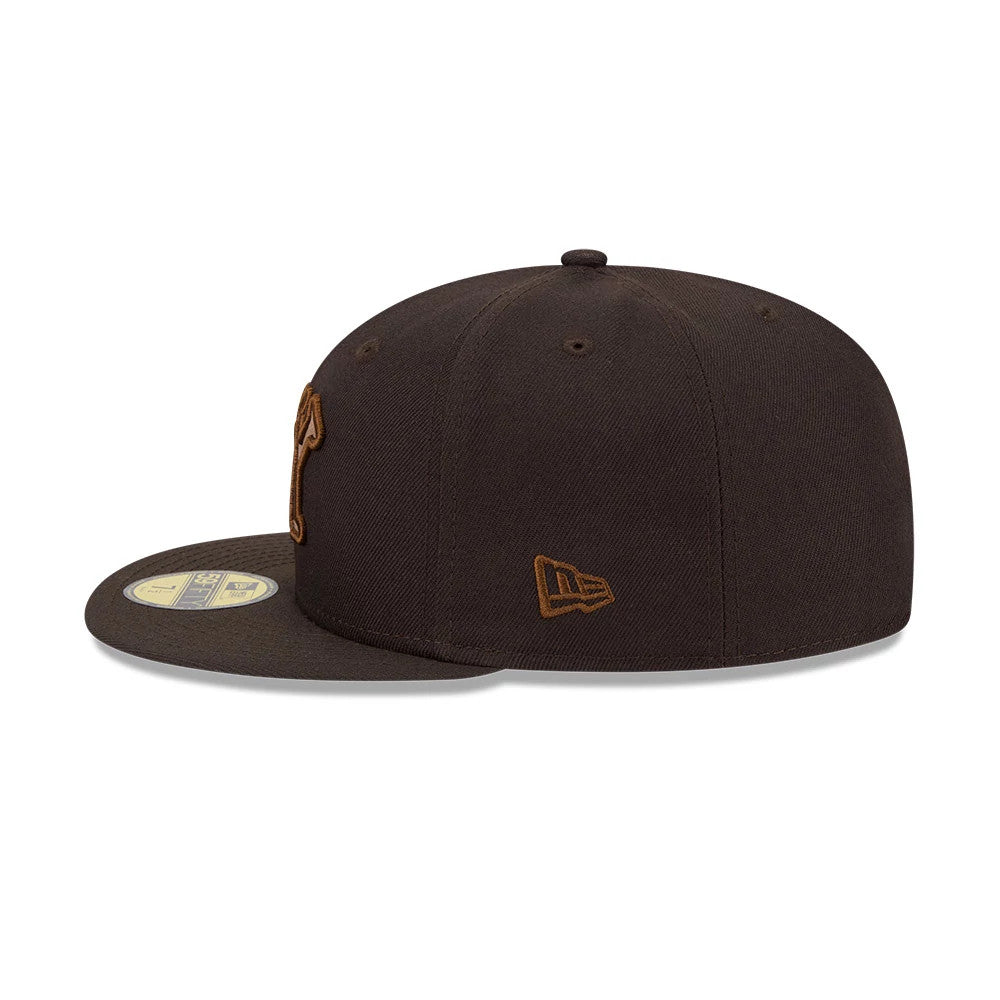 New York Black Yankees MLB Negro League Dark Brown New Era 59FIFTY Fitted Cap, side view showing the brown embroidered New Era flag logo on the left side of the structured dark brown crown and a gold 59FIFTY size sticker on the flat visor.