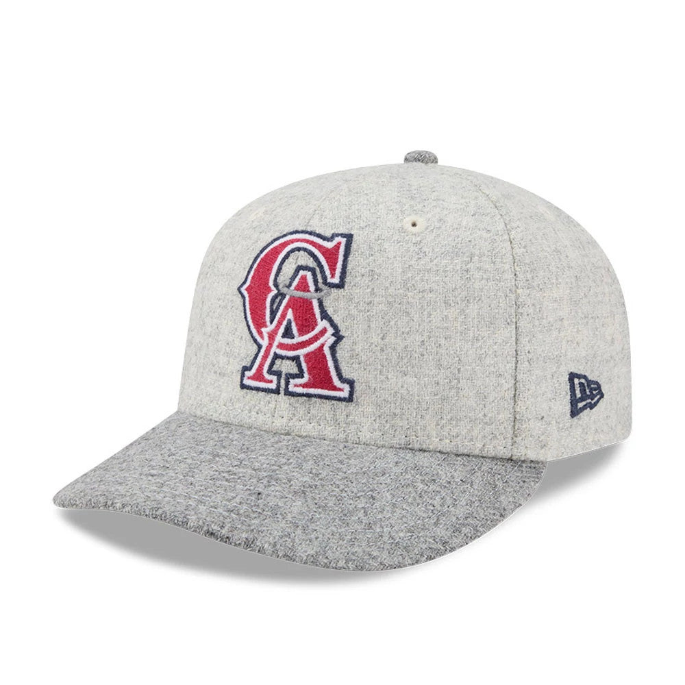LA Angels MLB X Moon Light Beige New Era 59FIFTY Fitted Cap, three-quarter view showing the raised red and navy embroidered team logo on the front panel, with a grey visor and blue New Era flag logo on the left side.