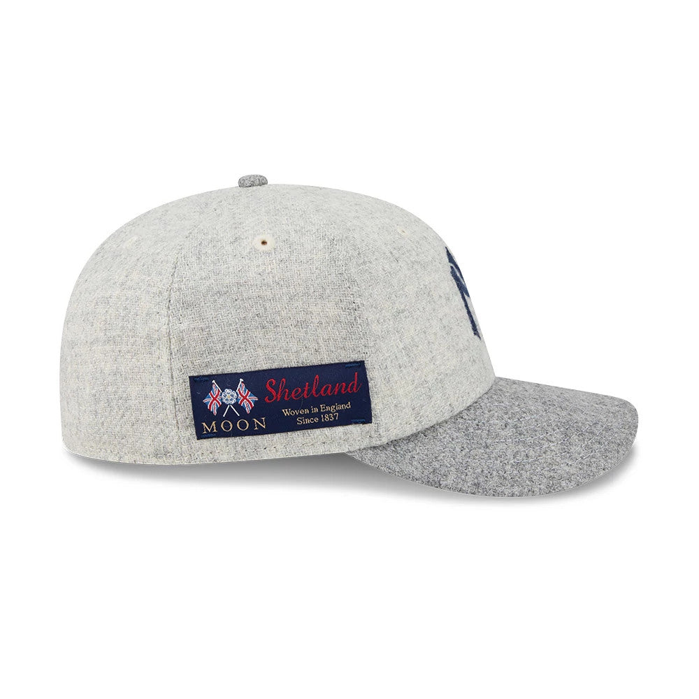 New York Yankees MLB X Moon Light Beige New Era 59FIFTY Fitted Cap, side view showing a navy and red Moon Shetland woven label on the light beige structured crown, with a grey visor and top button.