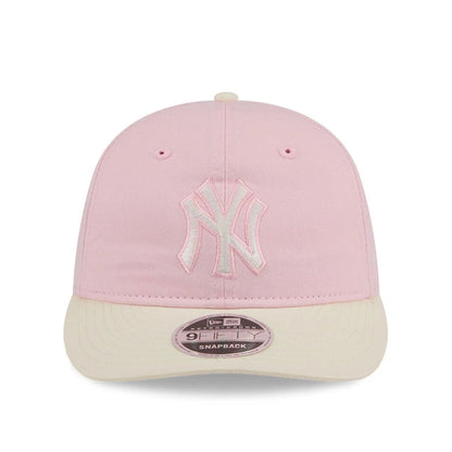 Pictured is this MLB Washed Tie Dye New York Yankees 9FIFTY Snapback cap in pastel pink. 2