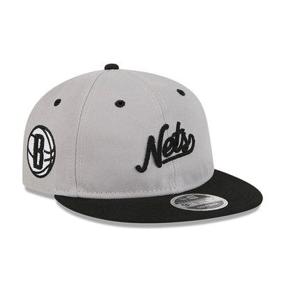 Pictured is this NBA Chainstitch Script Brooklyn Nets Retro Crown 9FIFTY cap in grey. 1