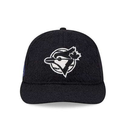 Toronto Blue Jays MLB X Moon Navy Retro Crown New Era 9FIFTY Adjustable Cap, front view showing the white embroidered Blue Jays logo with outlines on the front panel, paired with a navy flat visor and a textured crown.