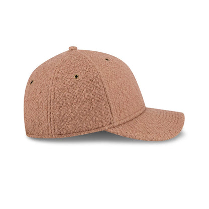 Pictured is this New Era Brushed Fleece 9FORTY M-Crown cap in Brown. 7