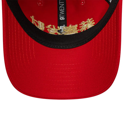 New Era Lunar New Year Red 9TWENTY Adjustable Cap, inside view showing a black sweatband, detailed golden embroidery under the crown, and a red undervisor with stitching, together with a white 9TWENTY label on the inner seam.