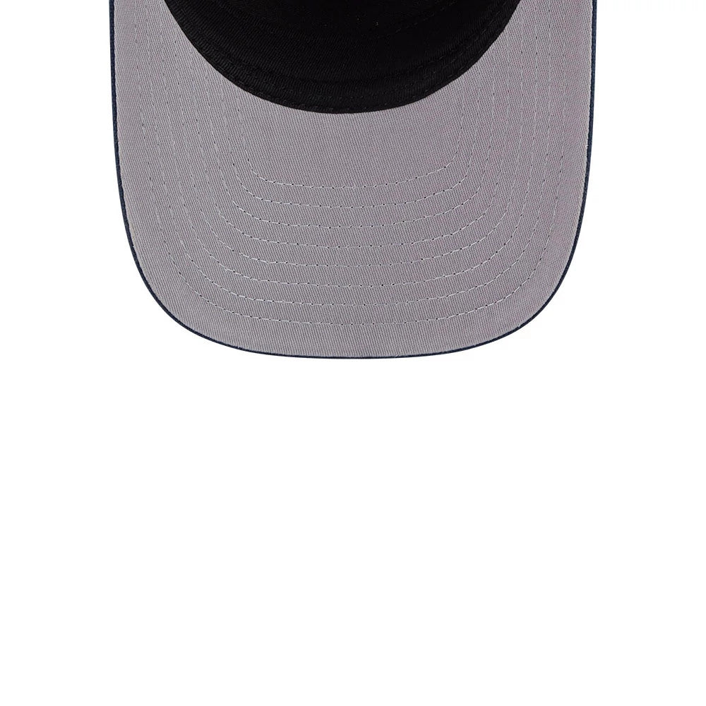 LA Dodgers MLB Grained Dark Blue New Era 9FIFTY A-Frame Snapback Adjustable Cap, inside view showing the contrast between the grey undervisor stitching and the dark sweatband, with a rounded visor edge from the top angle.