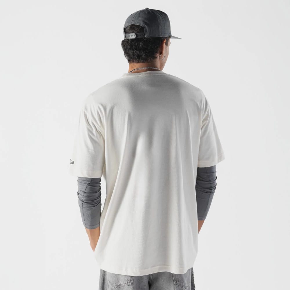 The model is wearing this Rick And Morty T-Shirt in cream. 2
