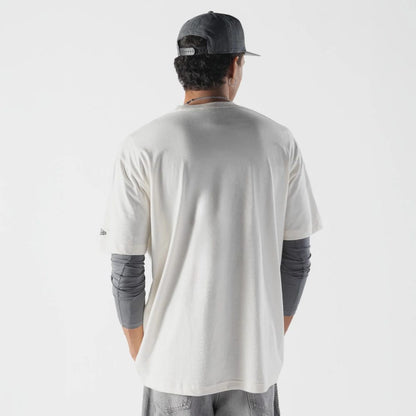 The model is wearing this Rick And Morty T-Shirt in cream. 2
