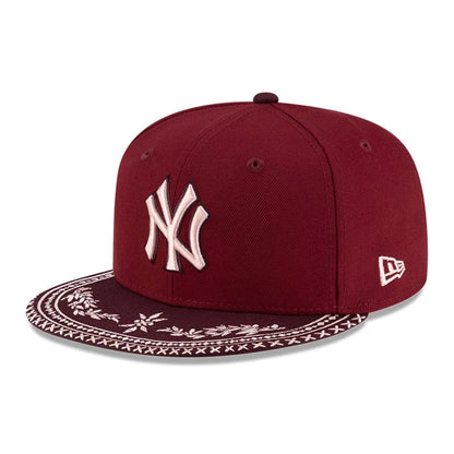 Pictured is this MLB Flourishes New York Yankees 59FIFTY Fitted cap in dark red. 4