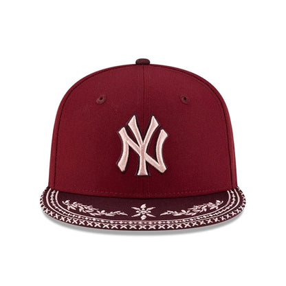 Pictured is this MLB Flourishes New York Yankees 59FIFTY Fitted cap in dark red. 3