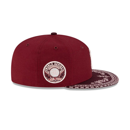 Pictured is this MLB Flourishes New York Yankees 59FIFTY Fitted cap in dark red. 5