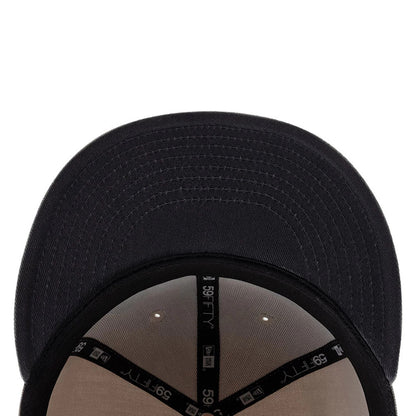 New Era DIY Note Light Beige 59FIFTY Fitted Cap, inside view showing the black taping with white 59FIFTY lettering, a light beige undervisor, and small circular eyelets on the structured crown, providing a detailed look at the construction.