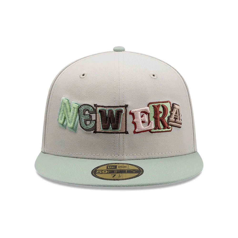 New Era DIY Note Light Beige 59FIFTY Fitted Cap, front view showing multicoloured, raised embroidered New Era lettering on the front panel, paired with a matching beige visor and gold 59FIFTY size sticker on the flat visor.