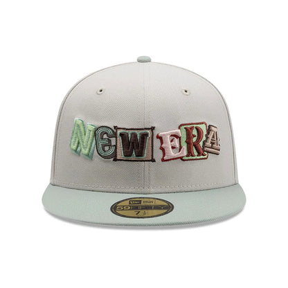 New Era DIY Note Light Beige 59FIFTY Fitted Cap, front view showing multicoloured, raised embroidered New Era lettering on the front panel, paired with a matching beige visor and gold 59FIFTY size sticker on the flat visor.
