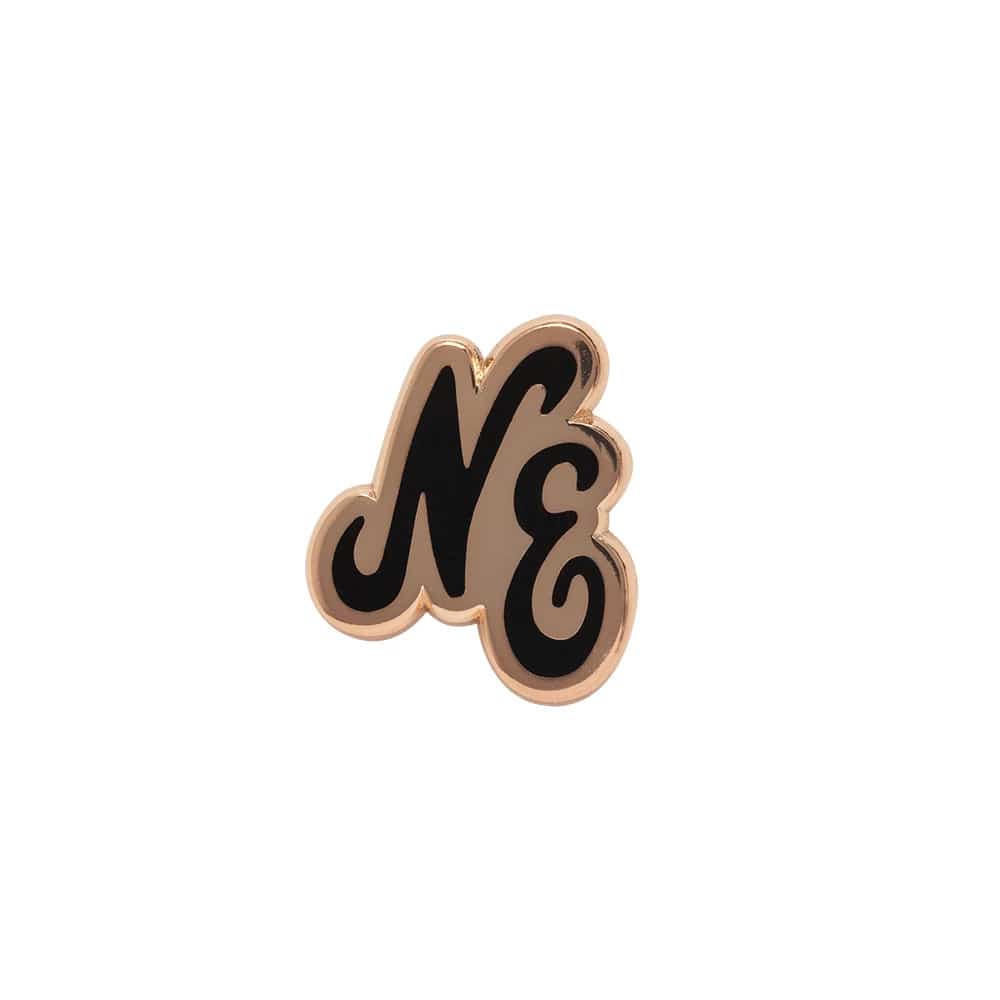 Pictured is this New Era Script Herritage Connect Rose Gold Pin Badge in rose gold. 1
