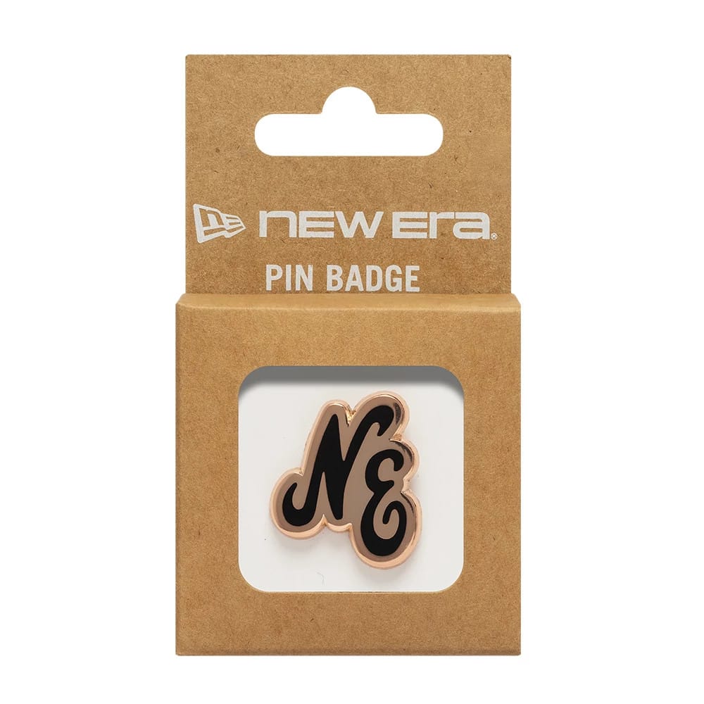 Pictured is this New Era Script Herritage Connect Rose Gold Pin Badge in rose gold. 3