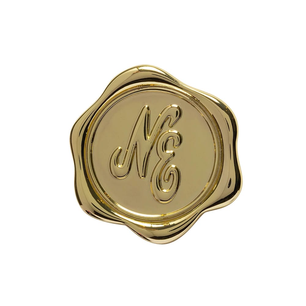 Pictured is this New Era Stamp Pin Badge in gold. 1