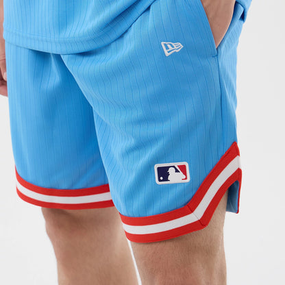 New Era New York Yankees MLB Arch Pastel Blue Oversized Shorts, side view showing pastel blue shorts with vertical pinstripes, a white embroidered New Era logo above the pocket, and an MLB Batterman logo above a red and white striped hem.