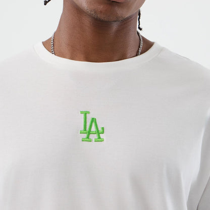 The model is wearing this MLB League Essential LA Dodgers Oversized T-Shirt in white. 5